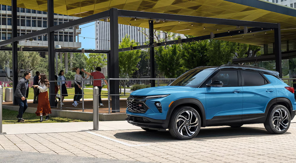 Blue 2025 Chevy Trailblazer for sale parked near a park.