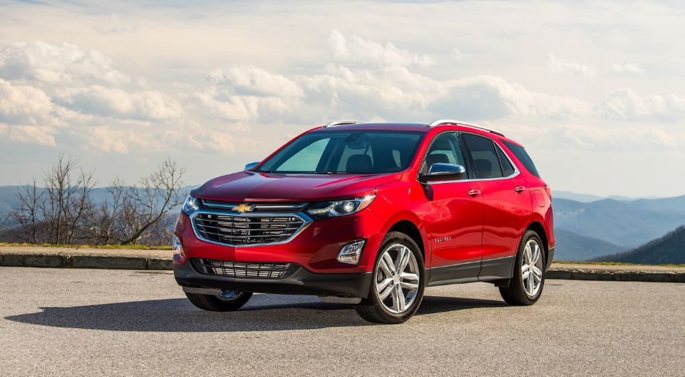 Red 2020 Chevy Equinox parked on pavement after visiting a dealer with a used Chevy for sale in Hopkinsville.
