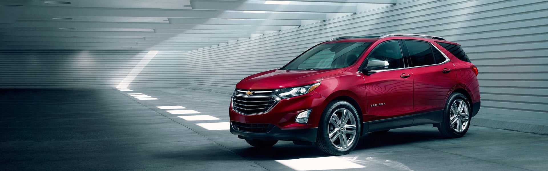 Red 2019 Chevrolet Equinox parked, highlighting its sleek design