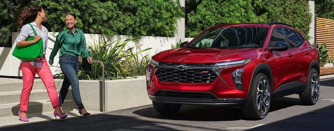 Red 2024 Chevy Trax parallel parked