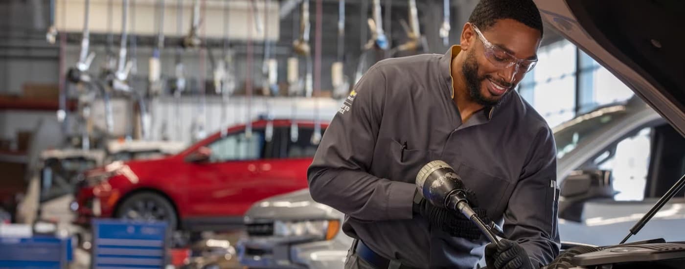 A technician working on a vehicle.