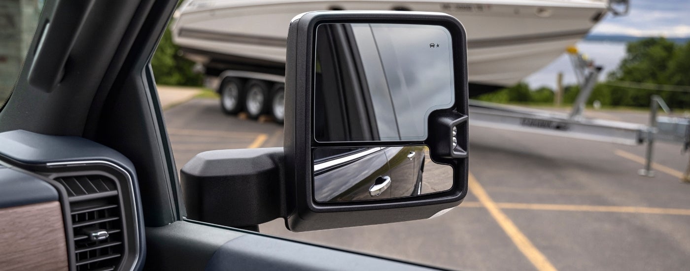 A close up of the side mirror on a 2024 Chevy Silverado 2500 for sale.