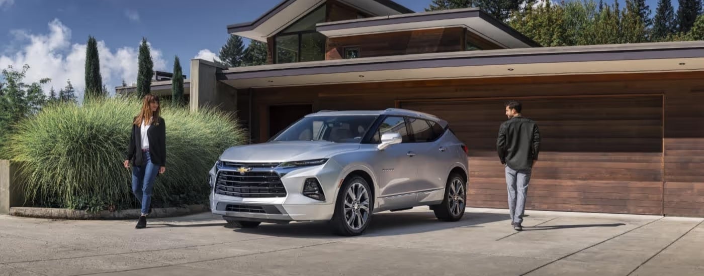 A silver 2021 Chevy Blazer is parked in a driveway.