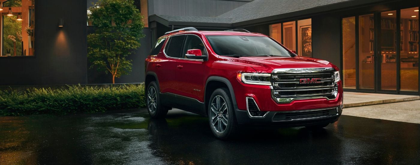 A red used 2023 GMC Acadia parked for sale